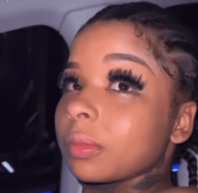 Woman With Long Eyelashes And Pigtails GIF