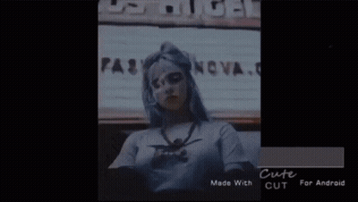 Woman With Long Gray Hair In White And Red Jacket GIF