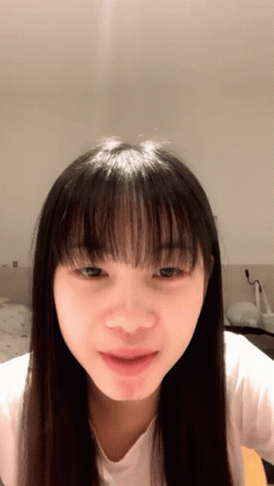 Woman With Long Hair And Bangs Close Up GIF
