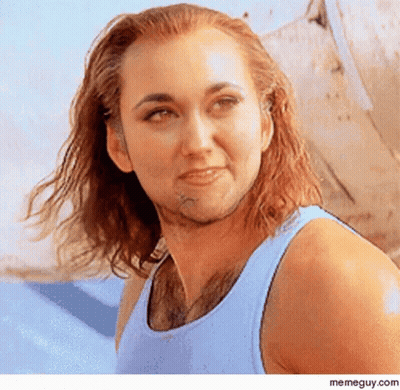 Woman With Long Hair And Beard In Blue Tank Top GIF