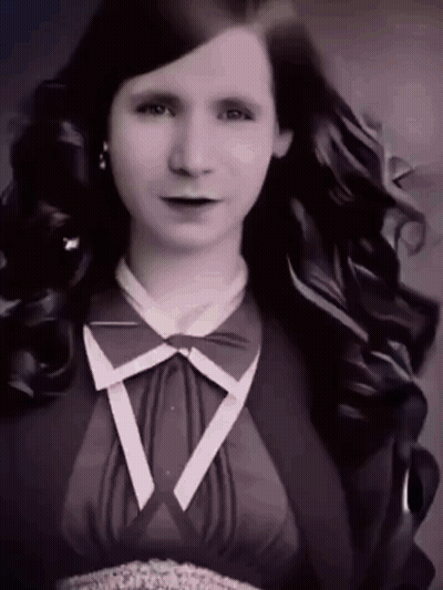 Woman With Long Hair And Bow Tie GIF