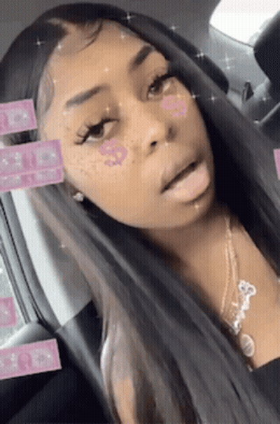 Woman With Long Hair And Freckles In Car With Necklace GIF