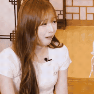 Woman With Long Hair And Microphone In Mouth GIF