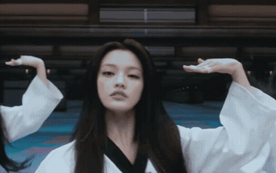 Woman With Long Hair And Mustache In White Robe GIF