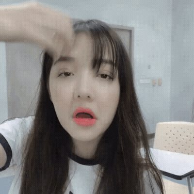 Woman With Long Hair And Red Lips Making Funny Face GIF