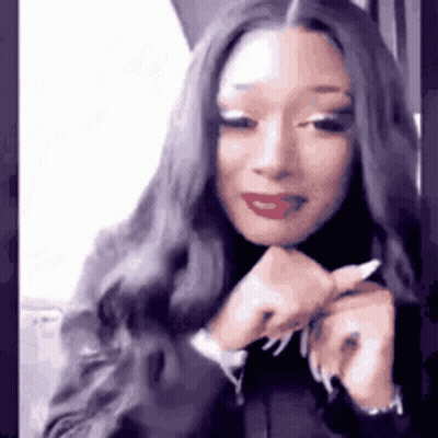Woman With Long Hair and Red Lipstick Making Face