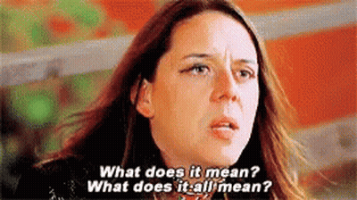 Woman With Long Hair Asking What Does It Mean GIF
