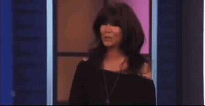 Woman With Long Hair Bangs Blue Wall Stage GIF