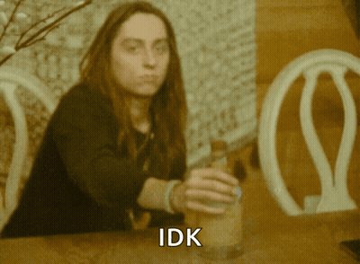 Woman With Long Hair Holding Bottle Saying IDK GIF