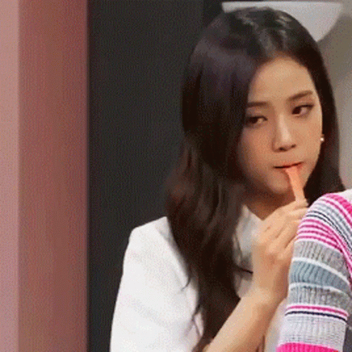 Woman With Long Hair Holding Finger To Lips GIF