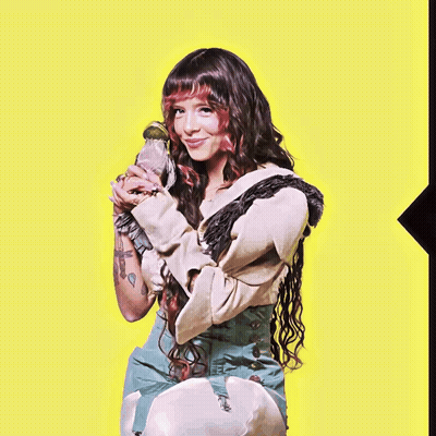 Woman With Long Hair Holding Parrot GIF