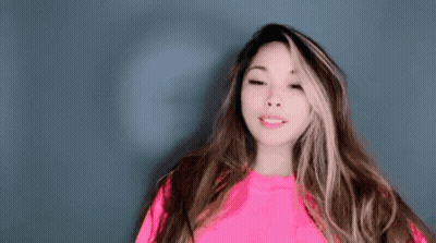 Woman With Long Hair In Bright Pink Sweater GIF