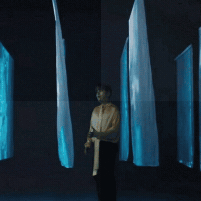 Woman With Long Hair In Front Of Belmont Sign GIF