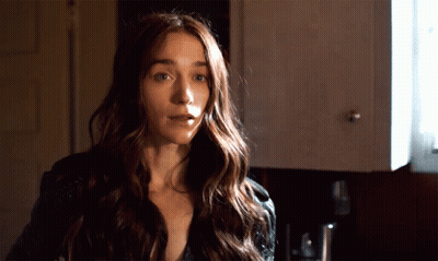 Woman With Long Hair In Front Of Cabinet GIF