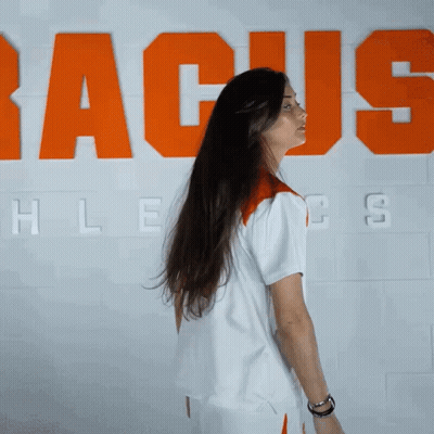 Woman With Long Hair In Front Of Racus Wall GIF