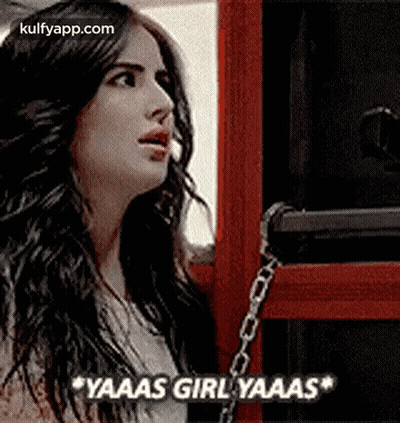 Woman With Long Hair In Front Of Red Box And Chain GIF