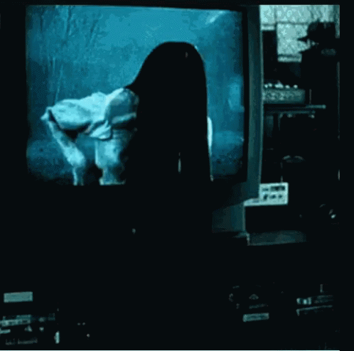 Woman With Long Hair in Front of TV