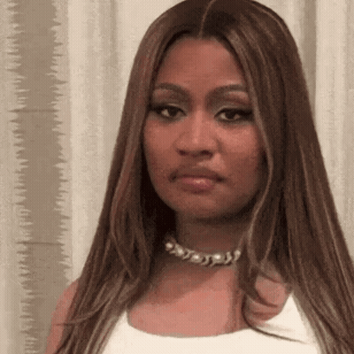 Woman With Long Hair In White Tank Top And Necklace GIF