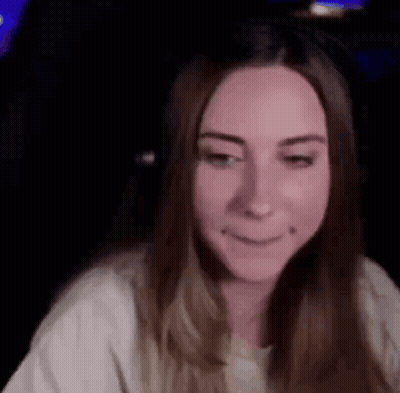 Woman With Long Hair Making Funny Face At Computer GIF