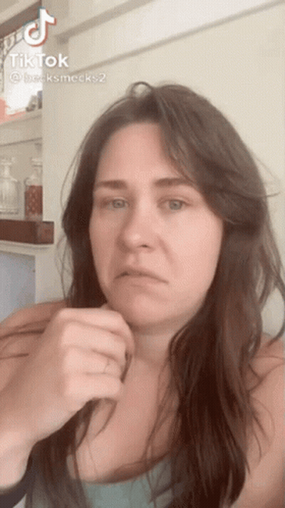Woman With Long Hair Making Funny Face In TikTok Video GIF