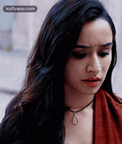 Woman With Long Hair, Nose Ring, Red Top, Necklace GIF