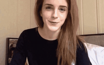 Woman With Long Hair Sitting On Bed GIF