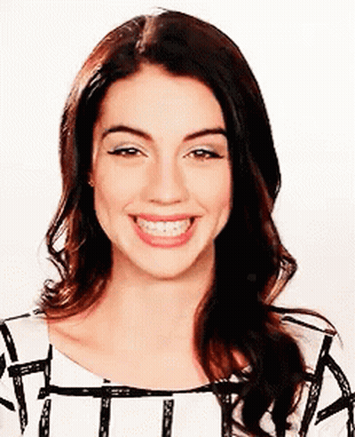 Woman With Long Hair Smiling In Striped Shirt GIF