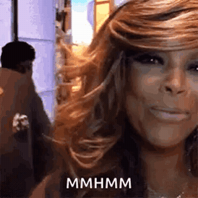 Woman With Long Hair Smiling, Man Behind GIF