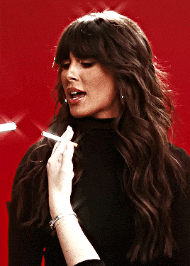 Woman With Long Hair Smoking Cigarette Red Background GIF