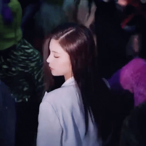 Woman With Long Hair Standing In Dark Room GIF
