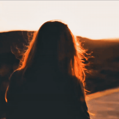Woman With Long Hair Watching Sunset GIF