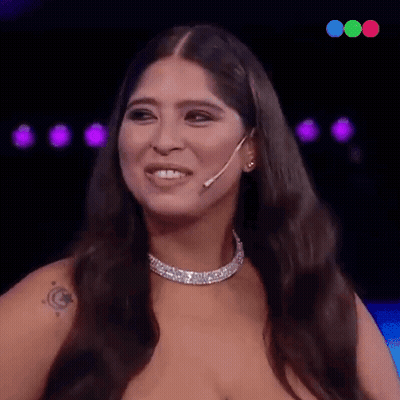 Woman With Long Hair Wearing Necklace And Earrings GIF