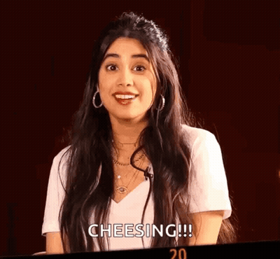 Woman With Long Hair White Shirt And Earrings Smiling GIF