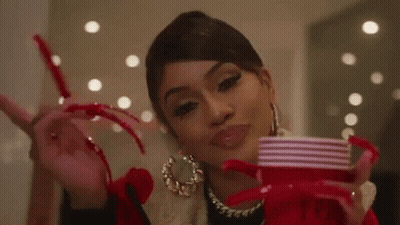 Woman With Long Nails Holding Red Cup Peace Sign GIF
