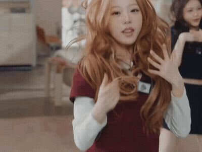 Woman With Long Red Hair And Name Tag A GIF