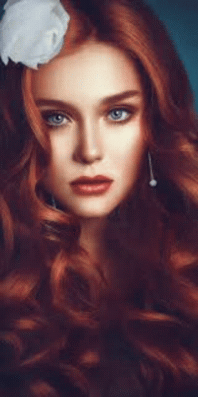 Woman With Long Red Hair And White Flower GIF