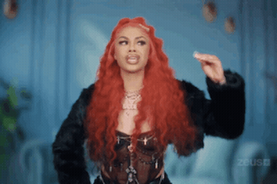 Woman With Long Red Hair In Black Jacket GIF