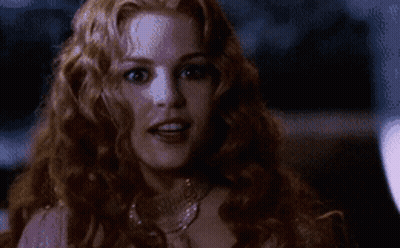 Woman With Long Red Hair In Pink Dress And Necklace GIF