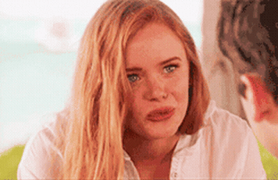 Woman With Long Red Hair Looking At Man GIF