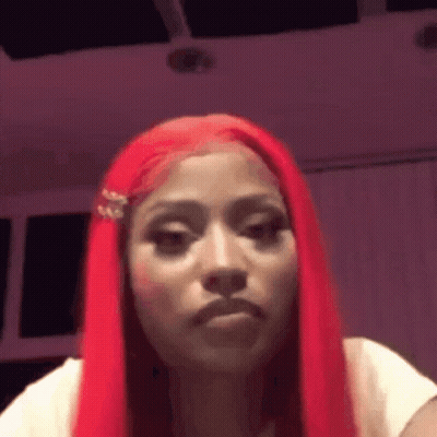 Woman With Long Red Hair Making Funny Face In White Shirt GIF
