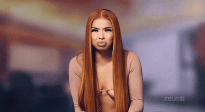 Woman With Long Red Hair Making Funny Face GIF