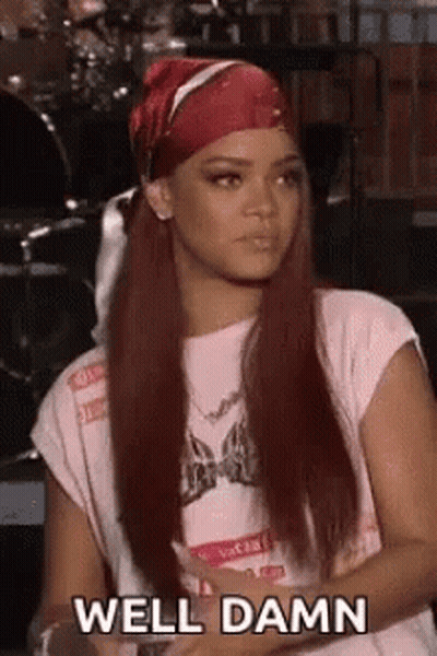 Woman With Long Red Hair Wearing Bandana And T-Shirt GIF
