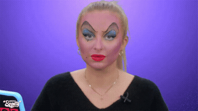 Woman With Makeup And Black Shirt Saying Beauty GIF