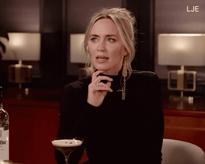 Woman With Martini Glass And Bottle Of Gin GIF