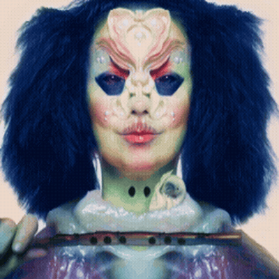 Woman With Mask Holding Flute GIF