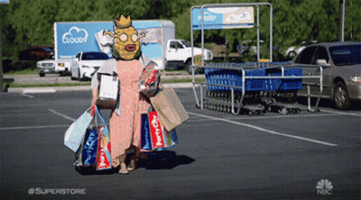 Woman With Mask On Head Carrying Shopping Bags At Superstore GIF