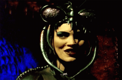 Woman With Mask On Head Smiling Says Yet GIF