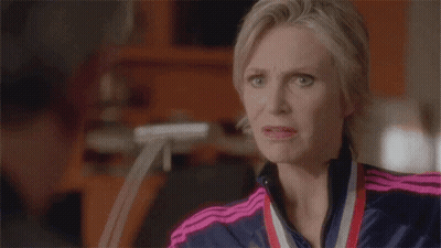 Woman With Medal Making A Face GIF