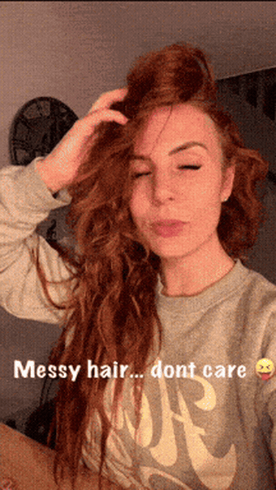 Woman With Messy Hair In Grey Nike Shirt GIF