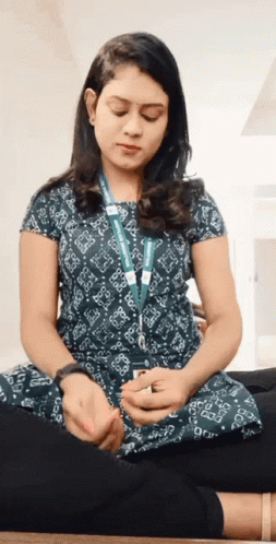 Woman With Microsoft Lanyard In Lotus Position GIF